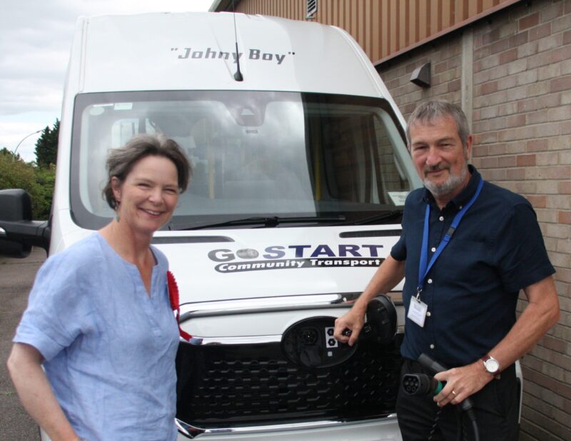 Arthur Humphries shows the new electric minibus to Emma